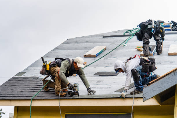 Professional Gutter Installation technician working in Bassfield, MS